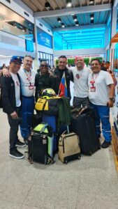 Responders carry rescue equipment and luggage