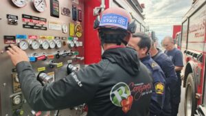 A foundation responder reviews equipment with another team