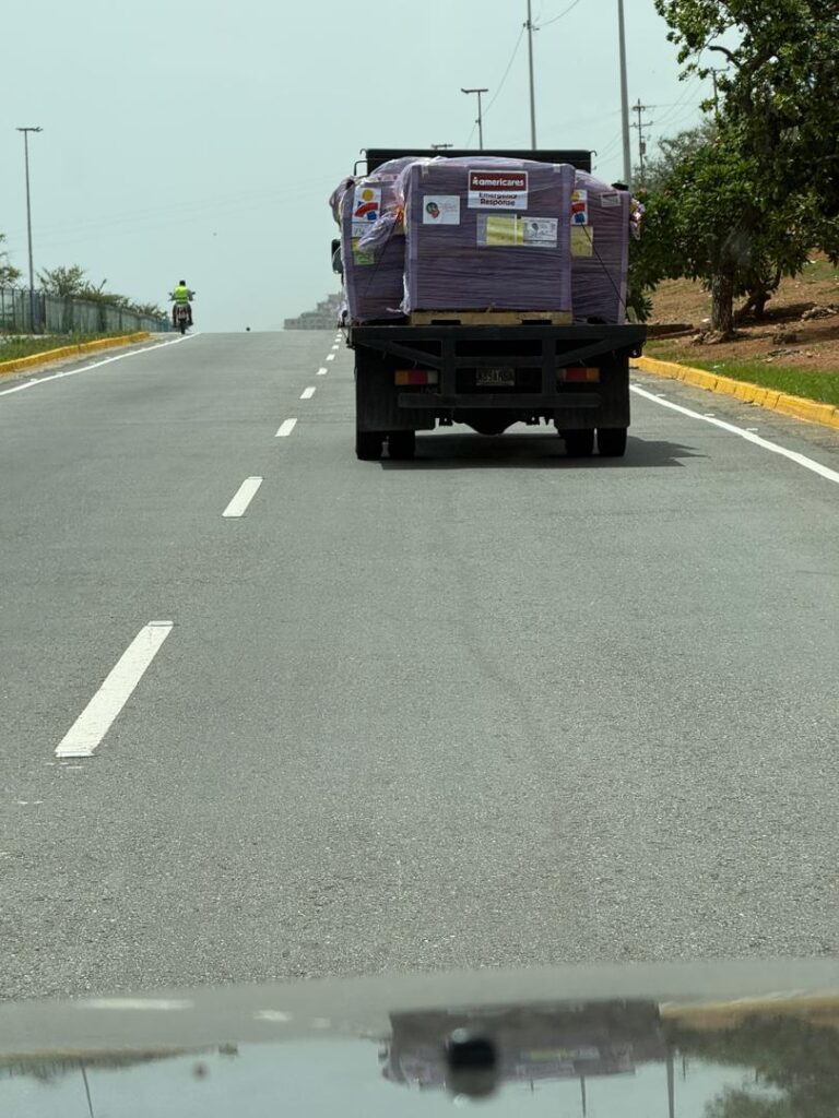 A truck carries the emergency shipment through La Guaira
