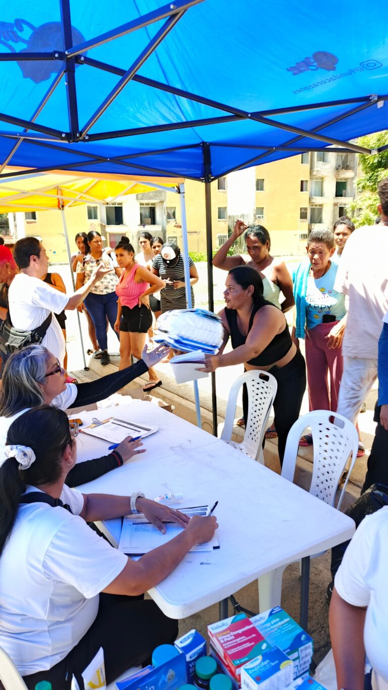 Volunteers coordinate the distribution of supplies to residents.