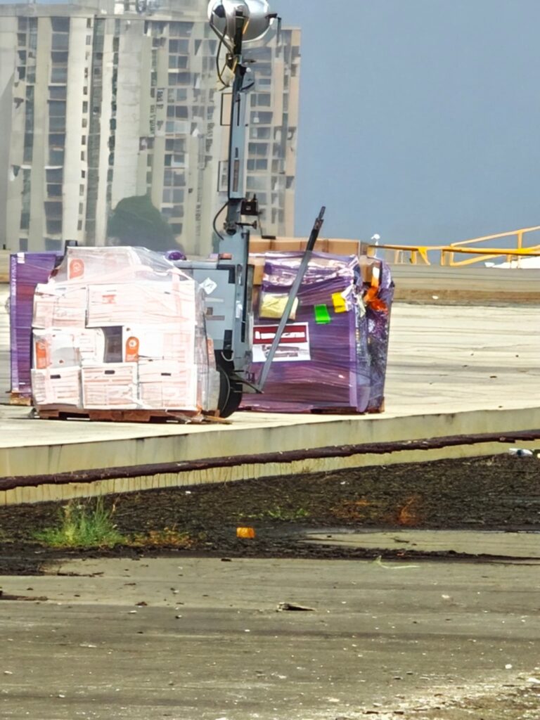 Americares emergency response pallets await transfer at the airport