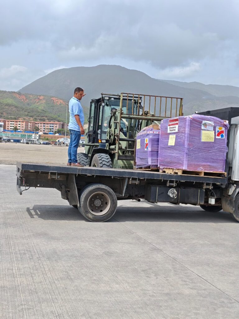 Americares emergency response pallets are loaded onto a truck at the airport