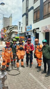 Rescue teams move through a street