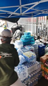 Bottled water is organized at a response base