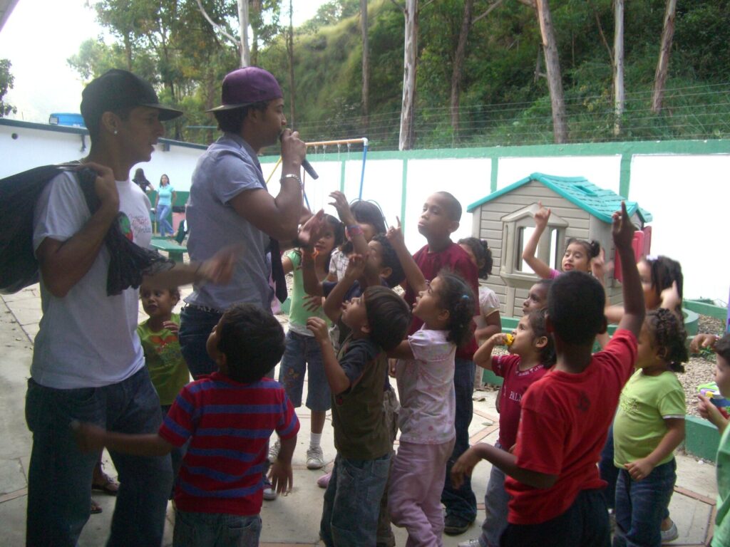 Children and volunteers gathered for music at Hogares Bambi Venezuela in December 2010.