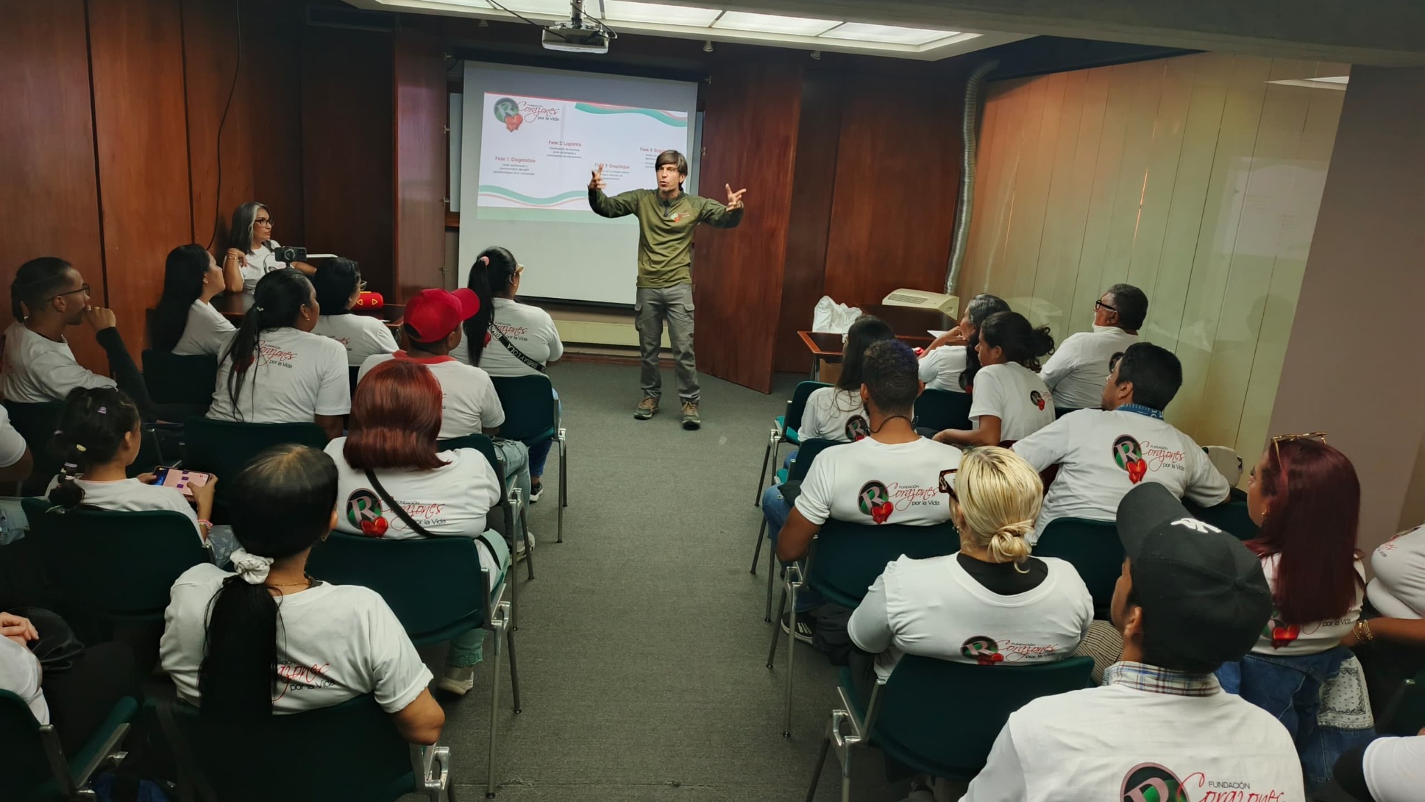 A coordinator leads a community-response training session for volunteers.