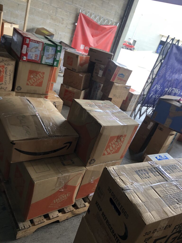 Volunteers checking and sorting cartons at the warehouse on March 18, 2019.