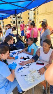 A health worker checks a community member’s blood pressure at the Mare Abajo outreach.